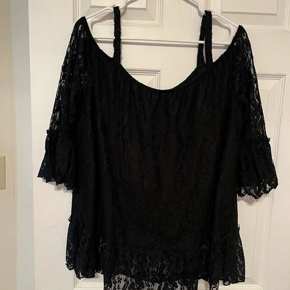 Black lace hangs off shoulders